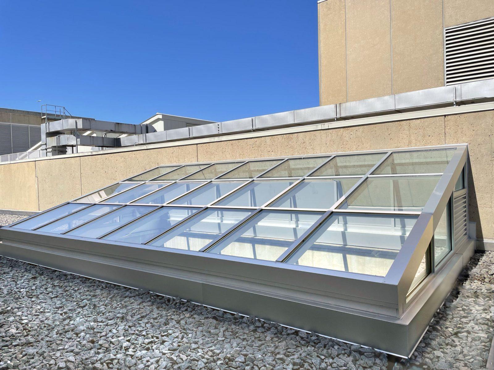 Roof monitor and skylight assembly on an existing building