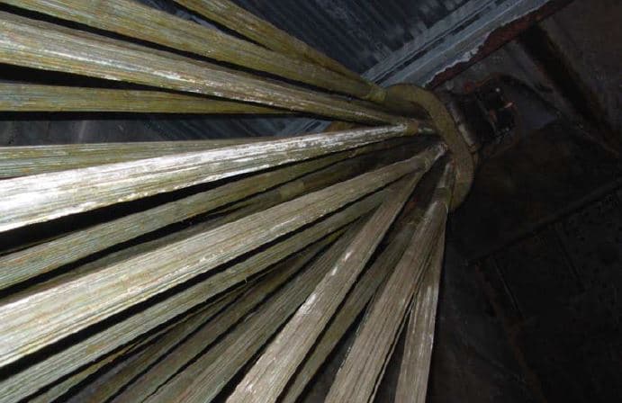Heavy timber and steel bridge framing seen from below