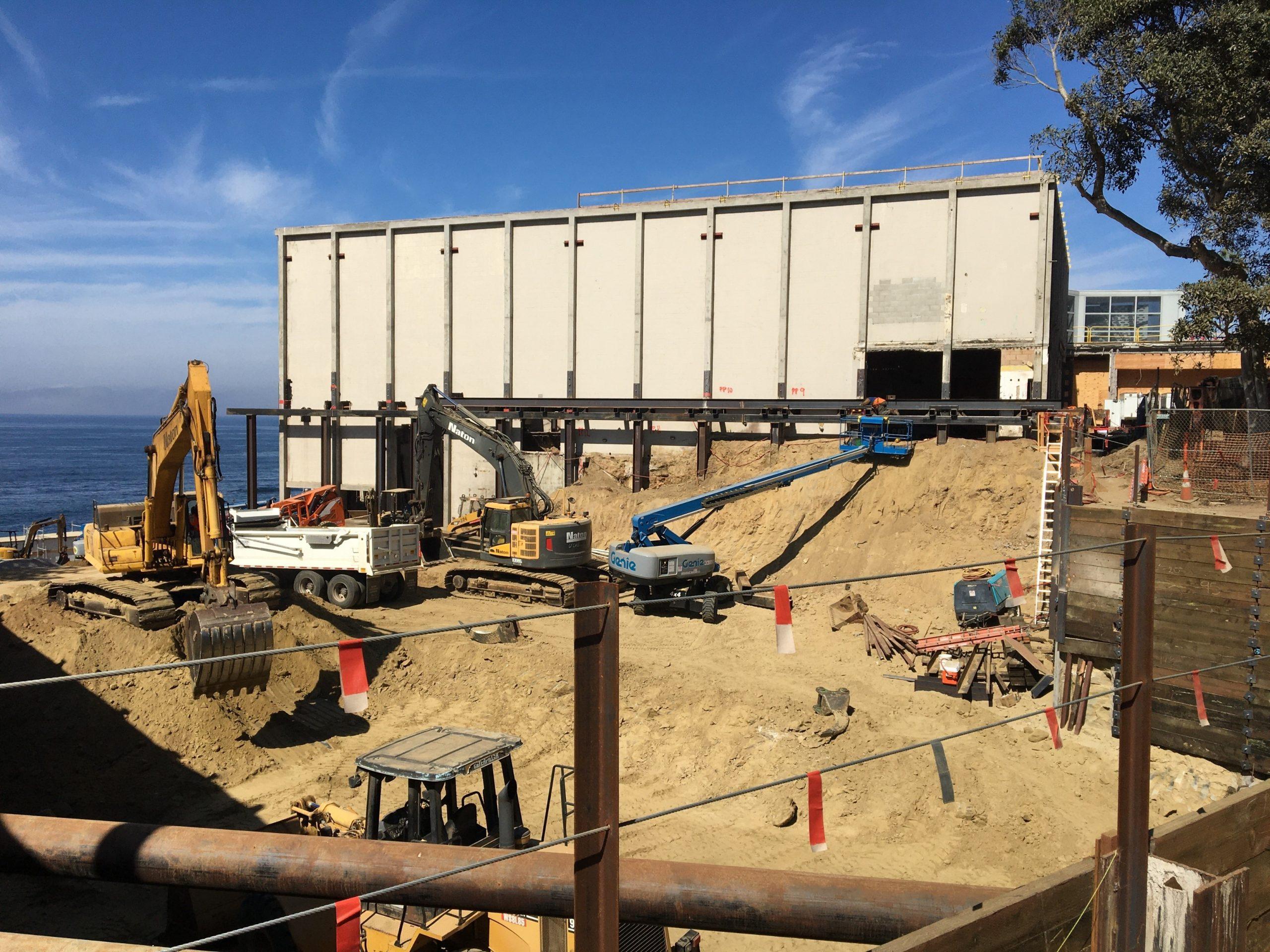 Construction site where new structure is inserted beside an existing building