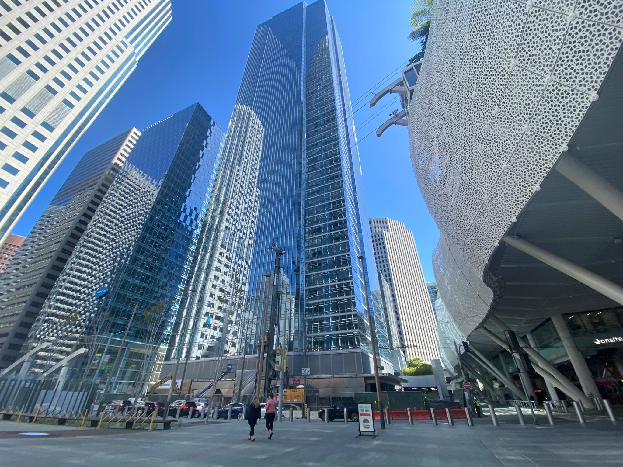 High-rise buildings and a patterned cultural building in a dense city