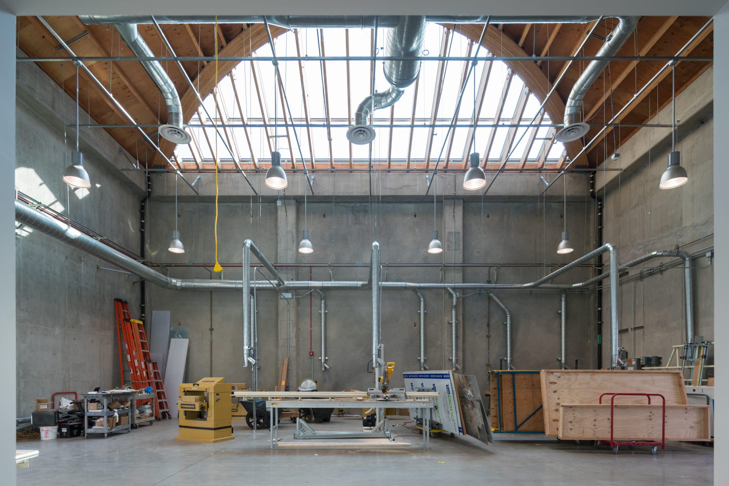 Daylit fabrication hall with exposed timber roof structure